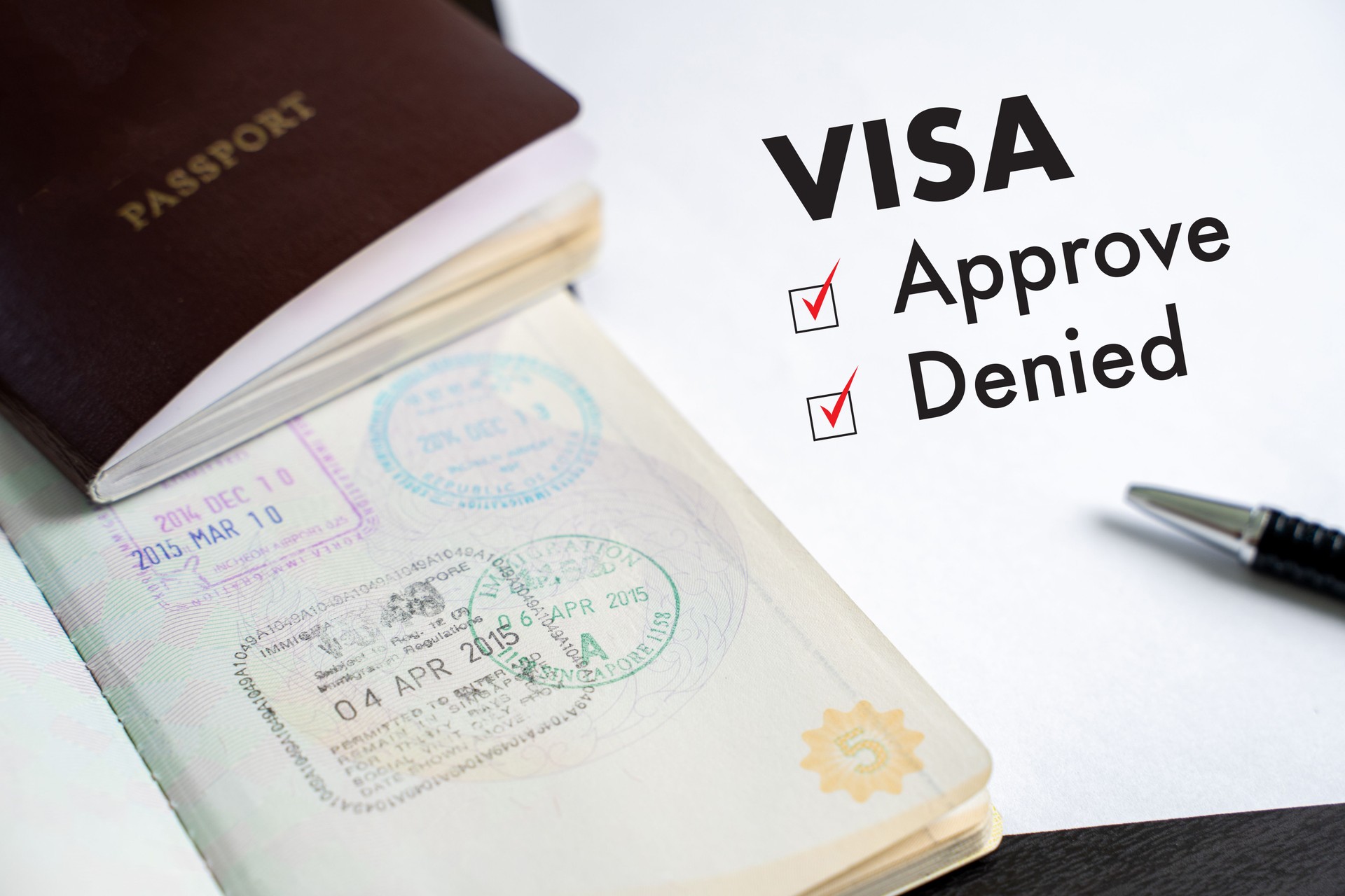 Visa and passport to approved stamped on a document top view in Immigration Visa approve